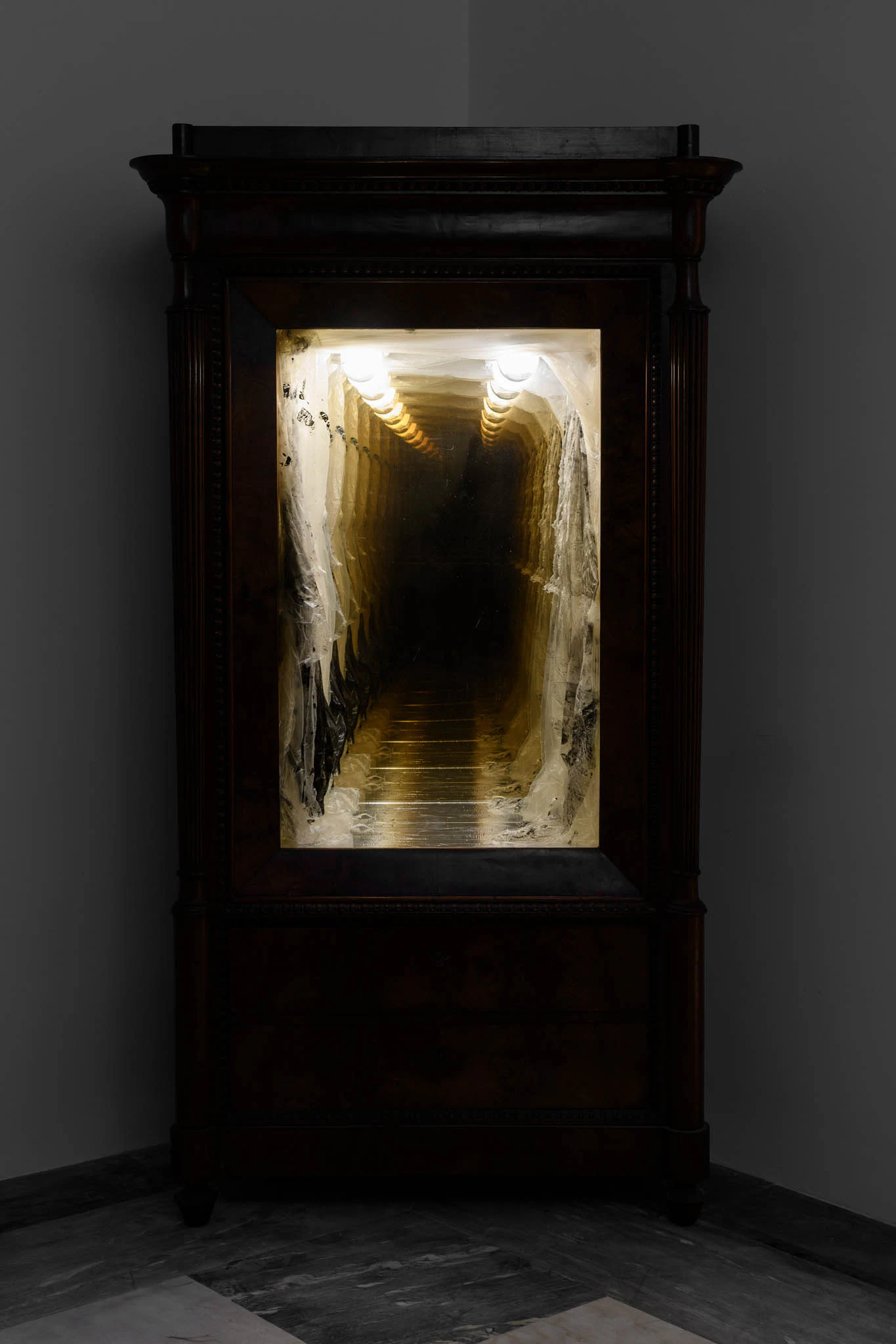 Daniele Milvio, Il sogno di Coleridge, 2025, Wood, two-way mirror, mirror, lighting equipment, ink, cellophane, steel foil, 83 1/2 x 45 1/4 x 21 5/8 in 212 x 115 x 55 cm