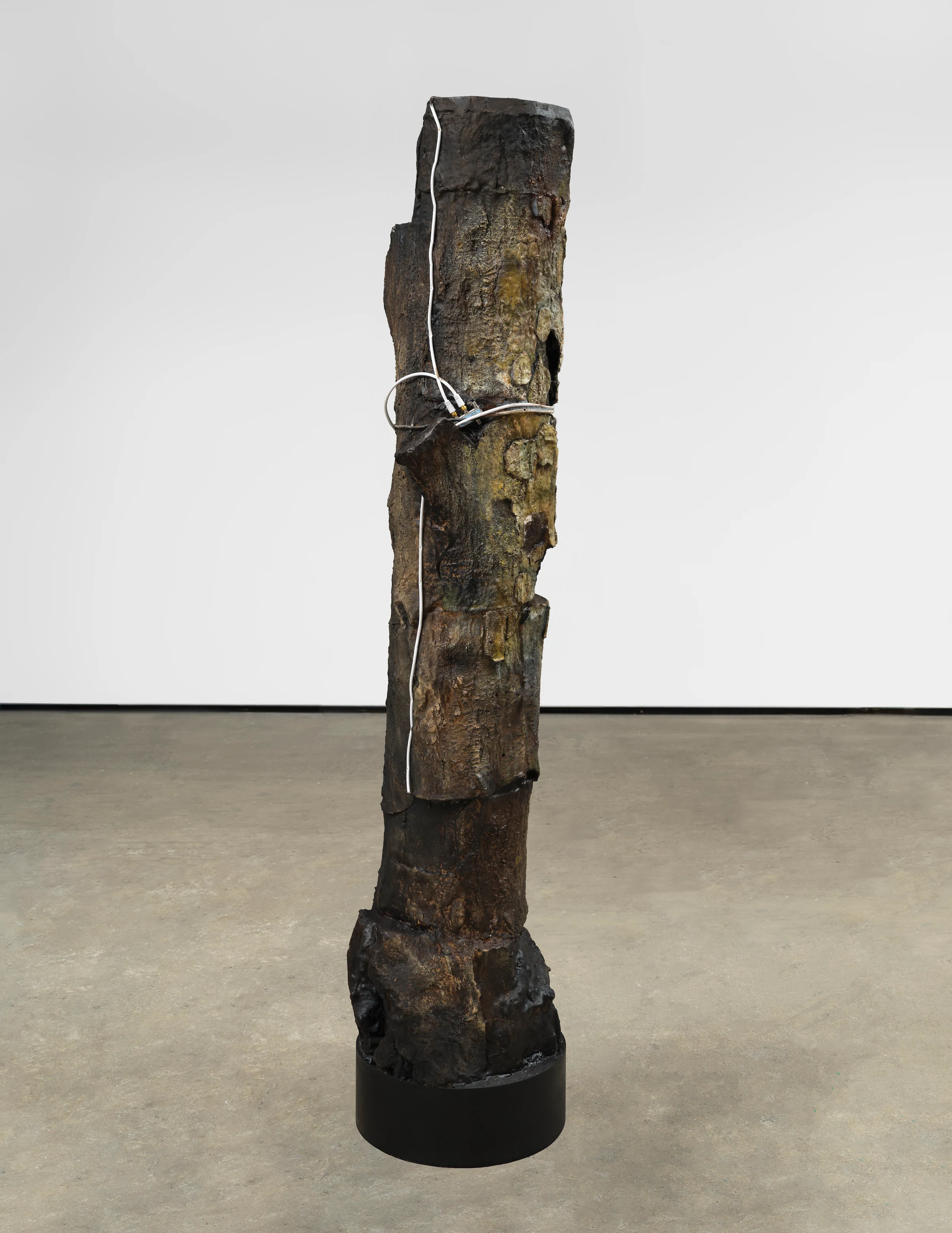 Brandon Ndife, Group Huddle (Satellite), 2026, Cardboard, foam, aqua resin, oil paint, cable, wax, 83 x 18 x 20 in 210.8 x 45.7 x 50.8 cm